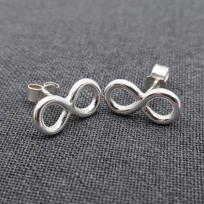Lindos aretes pequeños con símbolo de infinito de oro de plata de ley joyería diaria Foto 1 de 4