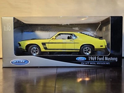 Ford Mustang Boss 302 Welly 1:18 DieCast 1969 amarillo y negro en caja Foto 1 de 4
