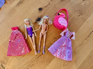 Bewegliche Barbie Puppe / Anziehpuppe und Klamotten - Bild 1 von 1