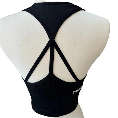 Sujetador deportivo negro sin costuras Gymshark Energy para mujer talla pequeña Foto 1 de 4