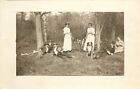 RPPC; People Laying About w/Border Collie Dog &Stringer of Fish~Posted Juneau WI