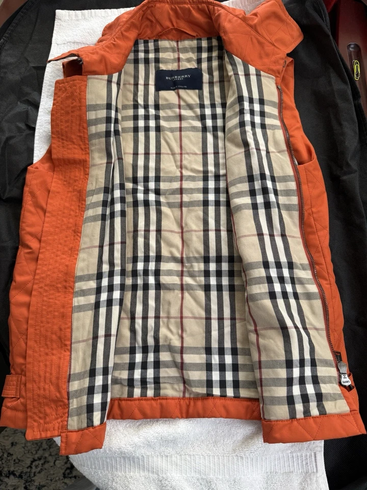 Hermoso chaleco acolchado Burberry para mujer forro a cuadros talla S naranja/azafrán/rojo Foto 1 de 4