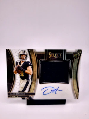 Jake Haener RPA /75 AUTO PATCH WHITE PRIZM 2023 Panini Select NFL Saints  - Image 1 of 2
