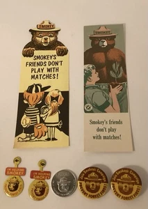 Smokey the Bear Vintage Advertisement Lot 6 Pieces 4 Pins 2 Bookmarks 1 Coin NEW - Picture 1 of 3