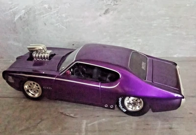 Pontiac GTO 1969 con soplador de motor The Judge púrpura 1:24 diecast de Jada Foto 1 de 4