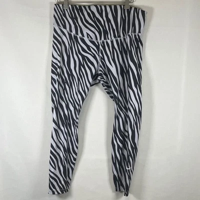 Женские леггинсы Nike Dri-Fit M с высоким подъемом для тренировок спортивные с принтом зебра на лодыжке  - Изображение 1 из 4