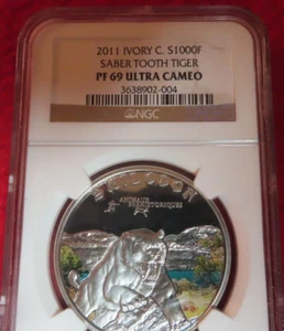 2011 Ivory Coast AFRICA SILVER Proof 1000 fr Sabre Tooth Tiger SMILODON NGC PR69 - Picture 1 of 12