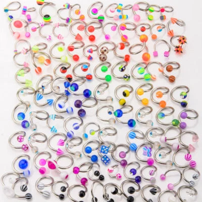 20, 50 o 100 anillos Twister surtidos - labio, nariz, oreja, vientre - 14ga-1/2" (12 mm) Foto 1 de 2