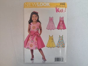 Patrón New Look - Vestidos para niñas; Cuatro estilos (3-8) #0186 - Sin cortar - Imagen 1 de 6