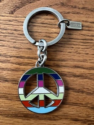 Llavero COACH Multicolor Legado Rayas Signo de Paz Foto 1 de 2