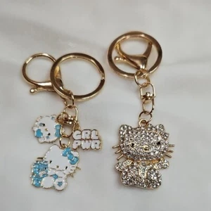 Hello Kitty Set 2 Schlüsselanhänger Taschenanhänger weiß blau silber Strass Kristalle - Bild 1 von 5