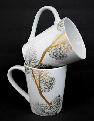 St. Nicholas Square Holiday Mugs Set of 2 White Silver Gold Pinecones 12oz - Image 1 of 4