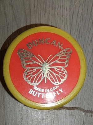 Vintage Yellow DUNCAN YOYO Butterfly  Orange background. Shiny Gold design - Image 1 of 4
