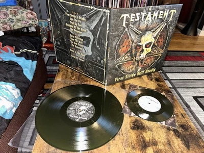 Testament First Strike Still Deadly + 7” 2-Song( Green Swamp Vinyls Ltd 1,000 - Image 1 of 4
