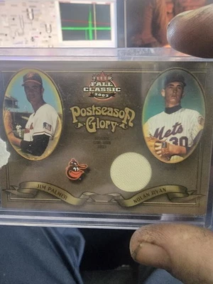 2003 FLEER FALL CLASSIC NOLAN RYAN JIM PALMER 55/150.GAME USED WORN JERSEY PATCH - Image 1 of 2