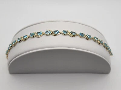 Brazalete de eslabones infinitos de oro amarillo topacio azul con forma de pera de 10 k para dama talla 7,5" Foto 1 de 4