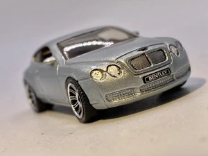 Matchboxđ„2006 Bentley Continental GT gris plata -1/64- - Imagen 1 de 10