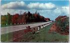 VINTAGE POSTCARD A FALL SEASON SCENE IN TAWAS CITY MICHIGAN [scratch on front]