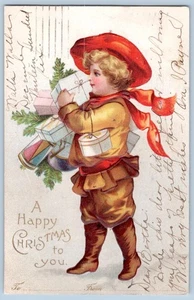 1906 HAPPY CHRISTMAS BOY DELIVERS GIFTS TO FROM EMBOSSED ANTIQUE POSTCARD - Picture 1 of 2