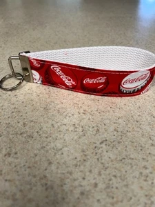 Key Ring Fob - Wristlet Style - Various Coke Logo's on Red Background w/ White - Picture 1 of 1