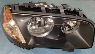 Conjunto de faros Hella diestro - 010166041 / 63-12-3-418-424 - para BMW X3 2004-2006 Foto 1 de 4