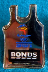 SYDNEY OLYMPIC GAMES 2000 SPONSOR BONDS SILVER SUPPORTER SINGLET SHIRT TROFE PIN - Picture 1 of 1