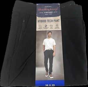 Pantalón tecnológico híbrido vintage resistente a la intemperie, color negro, 36x29 cintura flexible bolsillos con cremallera - Imagen 1 de 4