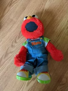 Muñeca Sesame Street Lets Pretend Elmo en mono 15" - Imagen 1 de 4