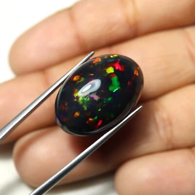 Ópalo negro etíope ahumado natural multi fuego 12,4 quilates ovalado 21,7 x 16,5 x 6,3 mm Foto 1 de 4