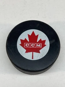 CCM CANADA HOCKEY PUCK RED MAPLE LEAF LOGO VINTAGE USED - Picture 1 of 4