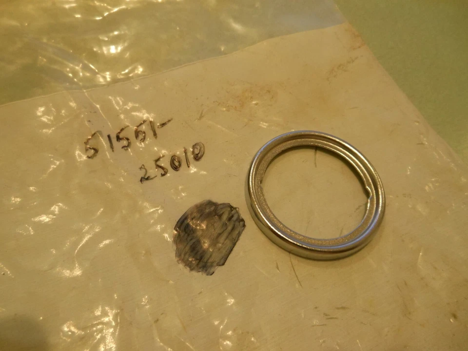 2 NOS OEM Suzuki GT185 RV125L +++ Seat Headlamp Bracket Qty.2 # 51551-25010 - Image 1 of 1