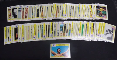 CONJUNTO BÁSICO COMPLETO 99 CARTAS COLEÇÃO HISTORY'S GREAT OLYMPIANS 1983 TOPPS - Imagem 1 de 4