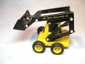 Ertl • New Holland Kompaktlader L555 1/64 Die-Cast - Bild 1 von 13