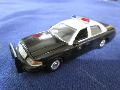 SpecCast 2001 Ford Crown Vic Wyoming State Patrol Police Trooper 1:64 Reg Bar - Image 1 of 4