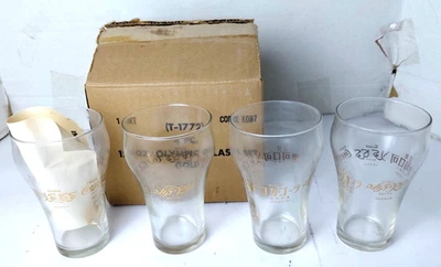 Conjunto de 4 copos de Coca-Cola vintage em forma de sino 12 oz. olímpicos 22kt. ouro na caixa - Imagem 1 de 2