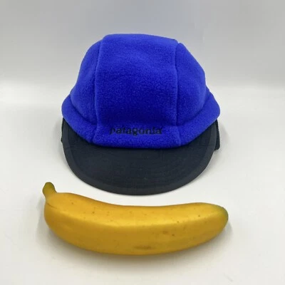 Sombrero Patagonia Azul Negro Synchilla Pato Bill Orejas de Perro De Colección M Nuevo Con Etiquetas Foto 1 de 4