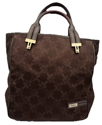 Bolso de Mano Tumi Doble Asa Cuero Borde Marrón Monograma Diamante Lona Bolso de Noche Foto 1 de 4