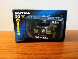 CÁMARA CAPITAL 35mm DE COLECCIÓN KX100 Diseño Negro y Amarillo con Correa (Nueva/Sellada) - Imagen 1 de 6