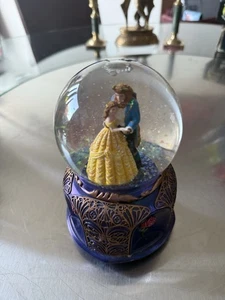 This is a "Beauty and the Beast" snow globe. - Picture 1 of 7