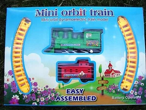 Modellino treno dinamoelettrico Mini Orbit. Motore VERDE. Caboose ROSSO nuovo in confezione! - Foto 1 di 4