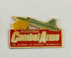 11 - Pin's AVION DE COMBAT- JOURNAL COMBAT ARMS