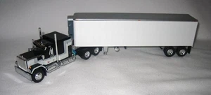 1/64th DCP 60-1923 Black GMC General w/60" Flat Top Sleeper 40' Vintage Trailer - Picture 1 of 3