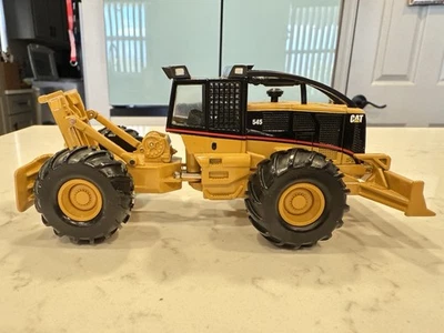 Patinadora de troncos con cable Caterpillar 545 2017 de Norscot escala 1/50 Foto 1 de 4