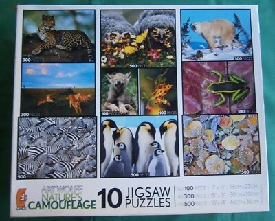 Ceaco 10 Art Wolfe Puzzles NATURE'S CAMOUFLAGE 2007 w/poster Bear Cats Zebra - Image 1 of 4