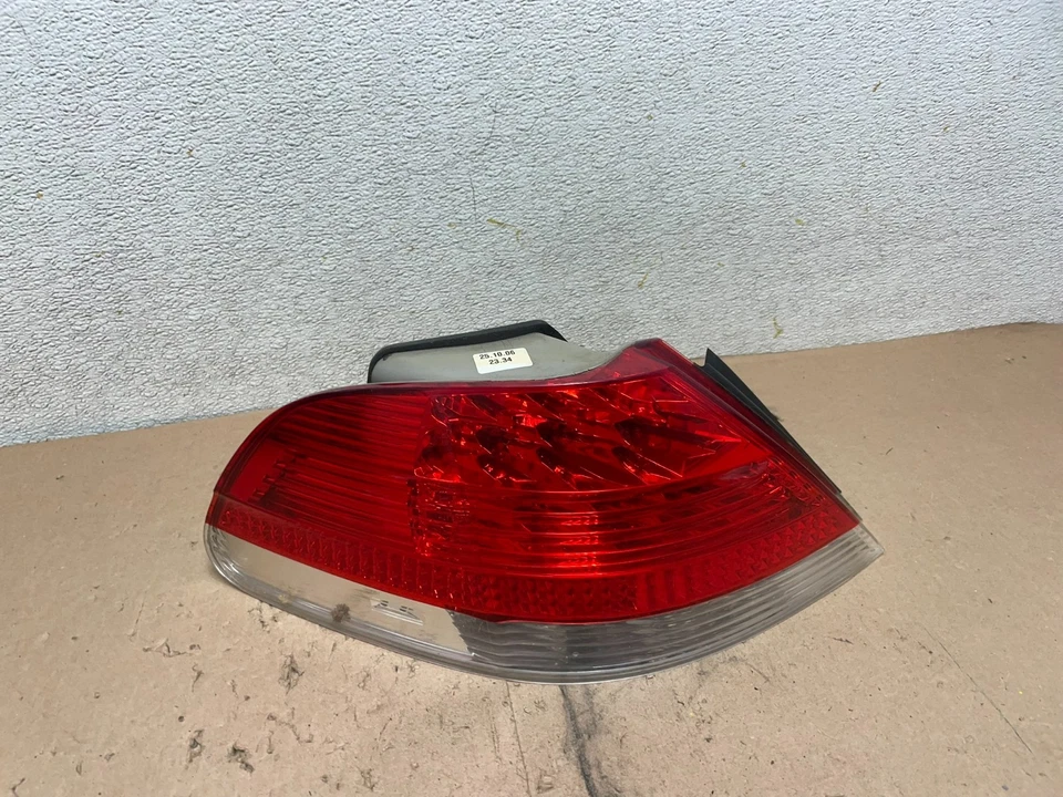 Lanterna traseira esquerda do motorista 2006 2007 2008 BMW 7-Series 750li 760li fabricante de equipamento original Q4865 DW - Imagem 1 de 4