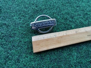1988-02 Nissan Pathfinder Rear "Nissan" Emblem Badge Name Plate 90891-2W100 5S3 - Picture 1 of 7