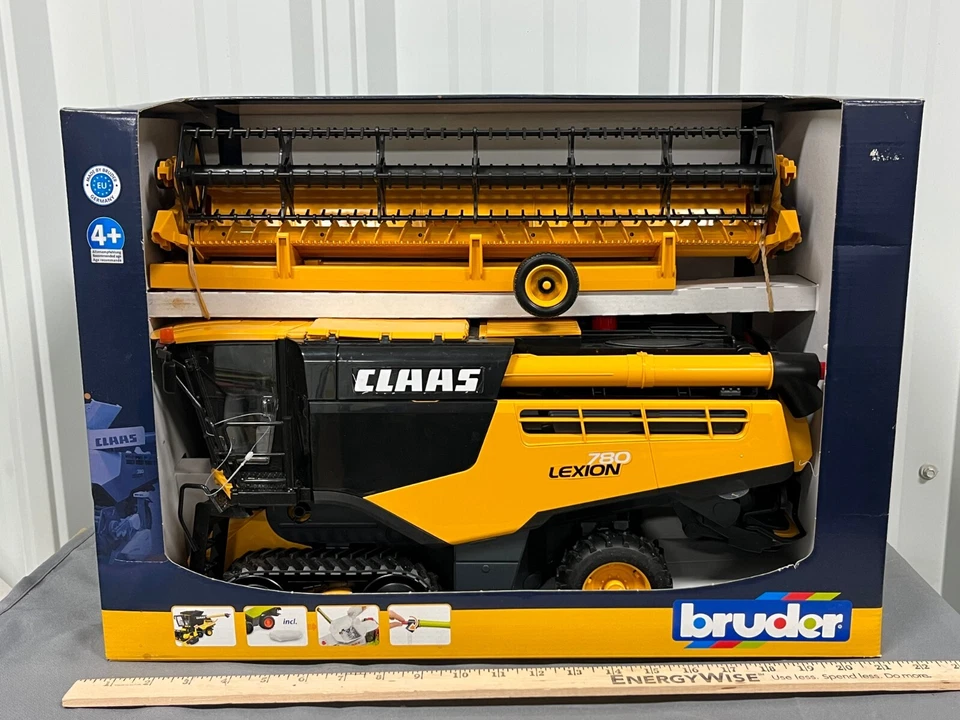 CLAAS Lexion 780 Bruder COMBINE 1:16 Scale NIB w/ Grain Head and Trailer Yellow - Image 1 of 4