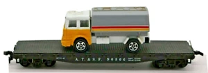 HO SCALE A.T.&S.F. 90806 Black Flat Car W/Hot Wheels Oil Tanker Delivery Truck - Picture 1 of 9