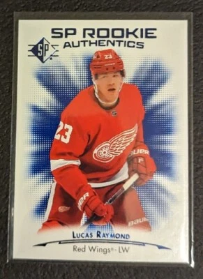 🏒 2021-22 SP Rookie Authentics  Blue ! Lucas Raymond RC Red Wings 🏒 - Image 1 of 2