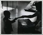 1958 Press Photo Ronald Reinke accompanied his mother to the polls - mja13103